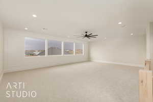 Unfurnished room with light colored carpet, ceiling fan, recessed lighting, and baseboards
