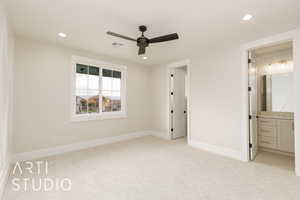 Unfurnished bedroom with light colored carpet, recessed lighting, baseboards, ensuite bath, and ceiling fan