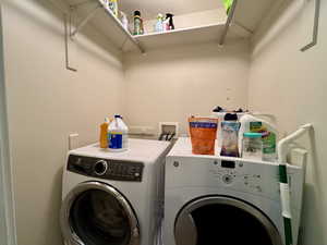 Washroom featuring washer and clothes dryer