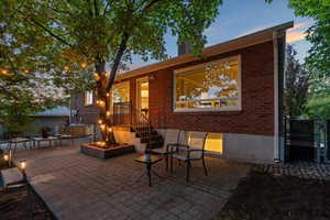 View of patio with an outdoor fire pit