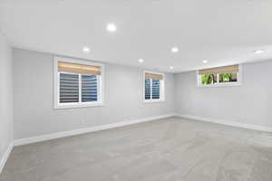 Spare room with carpet, recessed lighting, and baseboards