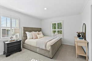 Bedroom featuring crown molding, carpet, baseboards, and recessed lighting