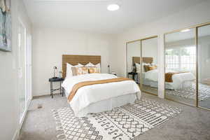 Master bedroom with mirrored closet doors