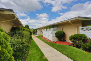 View of side of property featuring brick siding