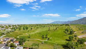 Bird's eye view of a mountainous background and a golf club