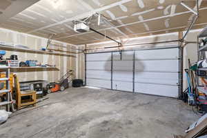 Garage featuring a garage door opener