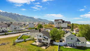 Aerial view of residential area featuring mountains