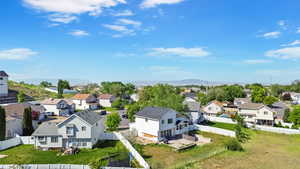 Aerial view of residential area featuring a mountainous background