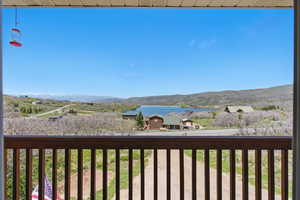 Exterior space featuring a water and mountain view