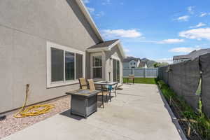 Fenced backyard featuring a patio and outdoor dining space