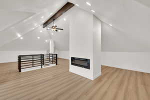 Additional living space with recessed lighting, wood finished floors, baseboards, and ceiling fan