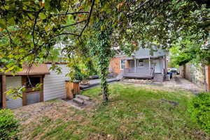 View of yard featuring a wooden deck