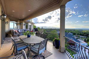 View of patio / terrace featuring a mountain view and a balcony