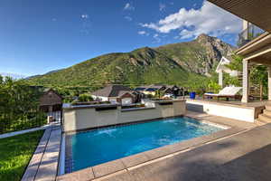 View of pool featuring a mountain view