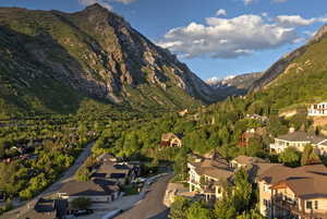 View of mountain backdrop featuring nearby suburban area
