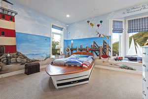 Carpeted bedroom featuring recessed lighting and baseboards