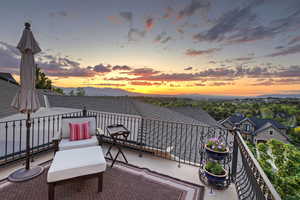 Patio terrace at dusk with a balcony