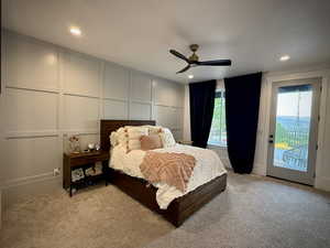 Bedroom with a decorative wall, access to outside, light carpet, recessed lighting, and a ceiling fan