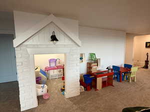 Game room with carpet floors