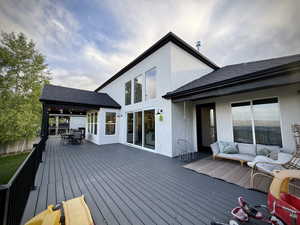 Deck featuring outdoor lounge area and outdoor dining area