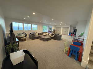 Living room featuring carpet and recessed lighting