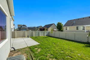View of yard with a patio and a residential view