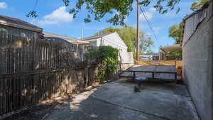 Fenced backyard with a patio area