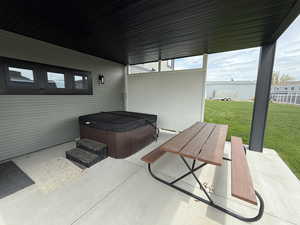 View of patio / terrace featuring a hot tub