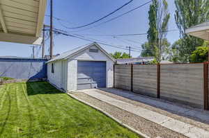 Detached garage featuring driveway