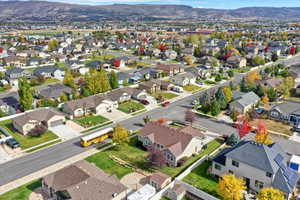 Aerial perspective of suburban area featuring a mountain backdrop