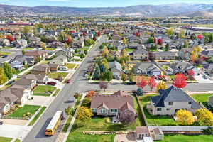 Aerial perspective of suburban area featuring a mountainous background