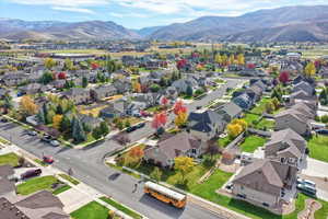 Aerial perspective of suburban area featuring a mountainous background