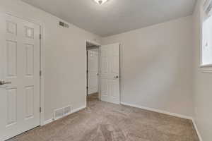 Bedroom with carpet flooring and baseboards