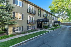 View of Ensign Condominiums private lane with parking area