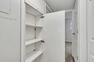 Built in closet in Hallway across from Full Bathroom