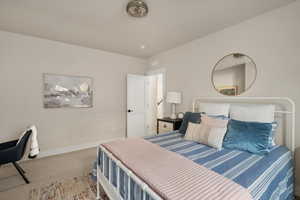 Bedroom with carpet and baseboards