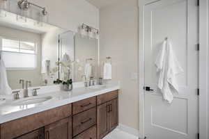 Bathroom featuring double vanity