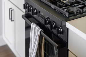 Kitchen view of black range with gas stovetop