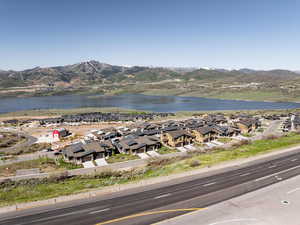 Aerial perspective of suburban area featuring a water and mountain view