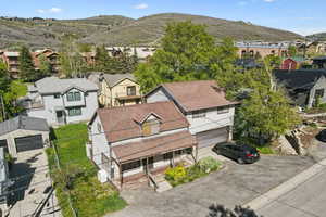 Aerial perspective of suburban area with a mountain backdrop