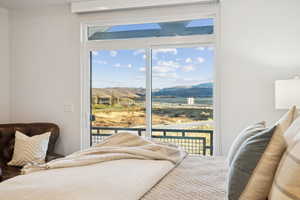 Bedroom featuring a mountain view and access to exterior