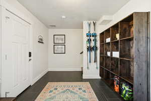 Entryway with wood tiled floors