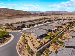 Aerial perspective of suburban area featuring a mountainous background