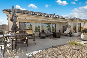 View of patio with an outdoor hangout area and outdoor dining space