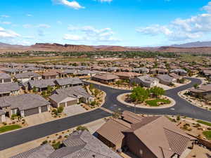 Aerial perspective of suburban area with a mountainous background