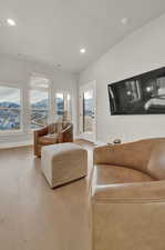 Living room featuring recessed lighting, baseboards, and wood finished floors