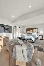 Bedroom featuring baseboards, recessed lighting, and a barn door
