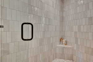 Bathroom featuring tiled shower