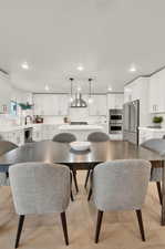 Dining space featuring recessed lighting