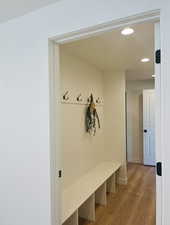 Mudroom featuring light wood-style floors and recessed lighting